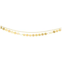 Goldene Multilayer Fußkette verstellbar Goldene, mehrlagige Fußkette mit verstellbarer Länge auf weißem Hintergrund