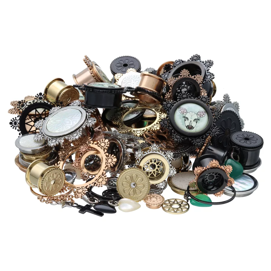 X-Change Ultra Set aus Chirurgenstahl Verschiedene Piercing-Sets aus Chirurgenstahl 316L in Gold, Schwarz und Silber auf weißem Hintergrund