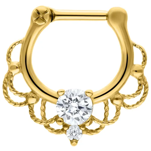Goldener Septum Clicker mit klarem Kristall auf weißem Hintergrund